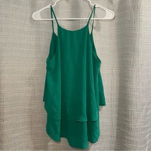 High neck green blouse with ruffle at bottom